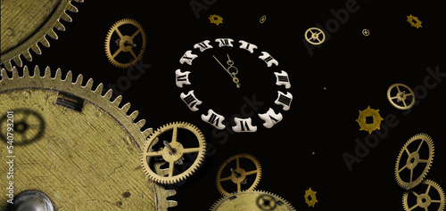 Parts of old watches with roman numerals on the dial in carved golden frame, isolated on black © hacohob