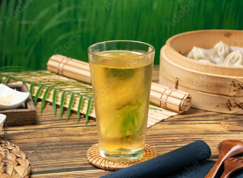 Green tea with napkin served in a wooden dish side view of taiwan food photo