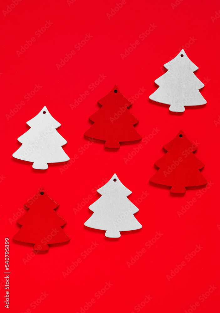 Set of retro red and white wooden Christmas tree toys on a red background. Copy space. Set of retro red and white wooden Christmas tree toys on a red background. Copy space.