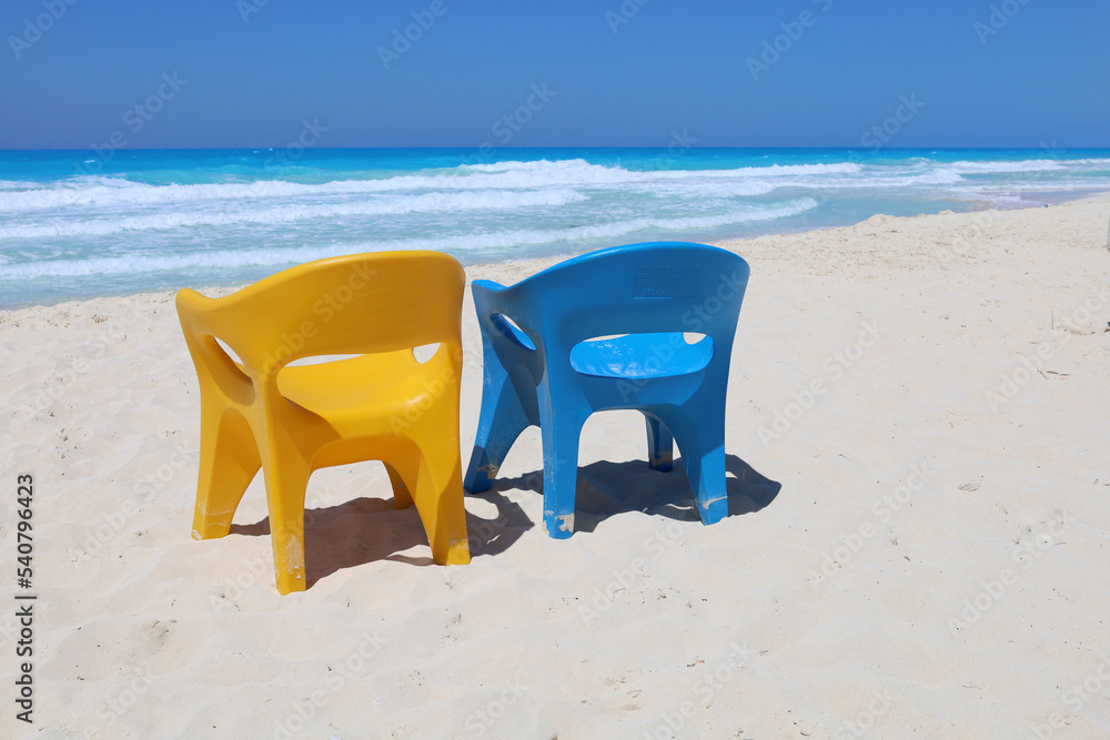 Blue and yellow chairs at sea beach, North coast of Egypt Blue and yellow chairs at sea beach, North coast of Egypt