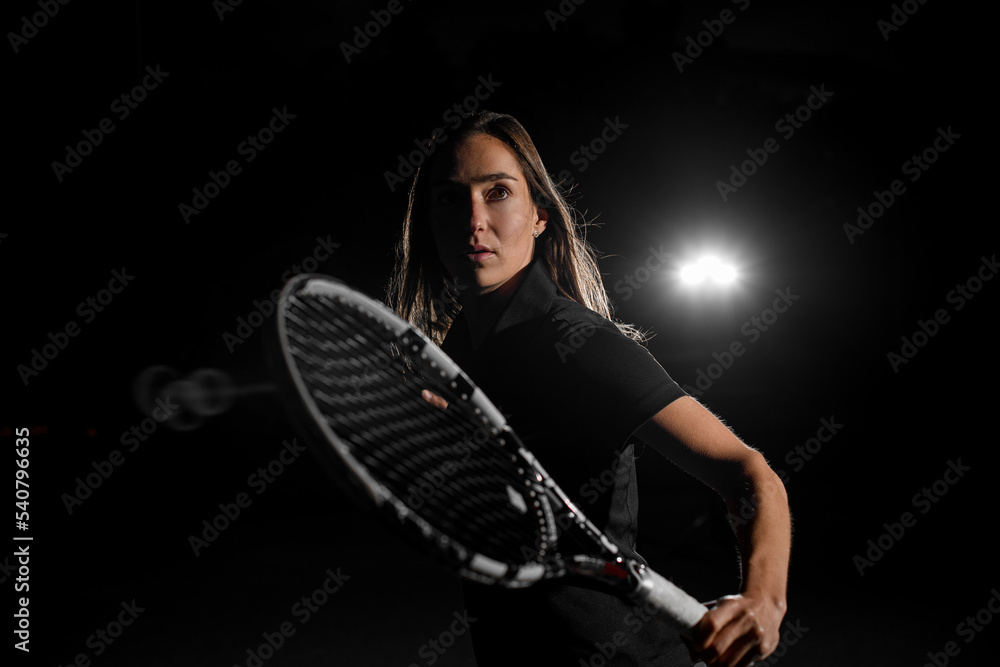 awesome beautiful portrait of woman with brown hair in black tennis uniform with tennis racket awesome beautiful portrait of woman with brown hair in black tennis uniform with tennis racket