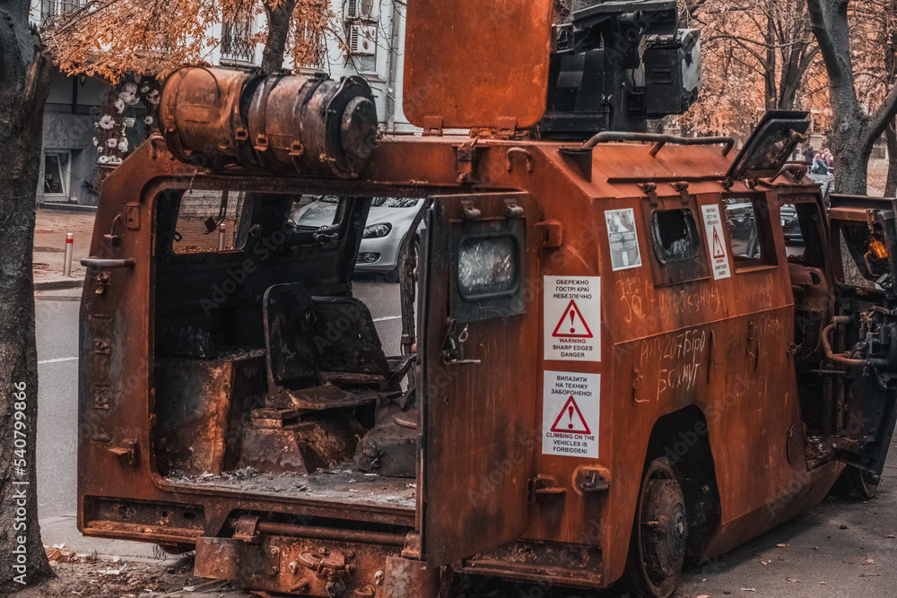 Fototapeta premium burnt armored car in the center of Kyiv 22.10.2022