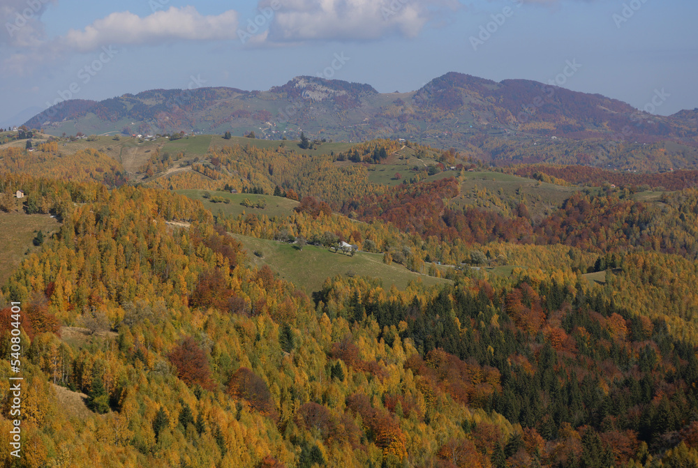 Autumn landscape over Magura village, Rucar Bran Pass between Bucegi and Piatra Craiului Mountains with the amazing villages landscapes and old houses. 