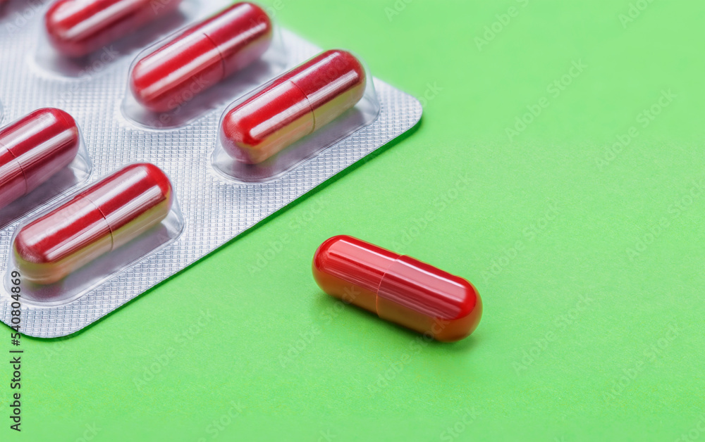 Tablets. Medicine. The science. Pills for diseases on a green background. Tablets. Medicine. The science. Pills for diseases on a green background.