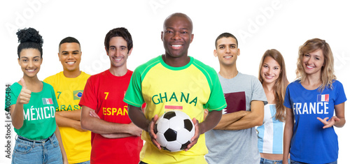 Fototapeta Naklejka Na Ścianę i Meble -  Football fan from Ghana with soccer ball supporters from Spain Brazil Mexico Qatar Argentina and France