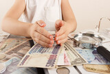 Child with different coins and banknotes