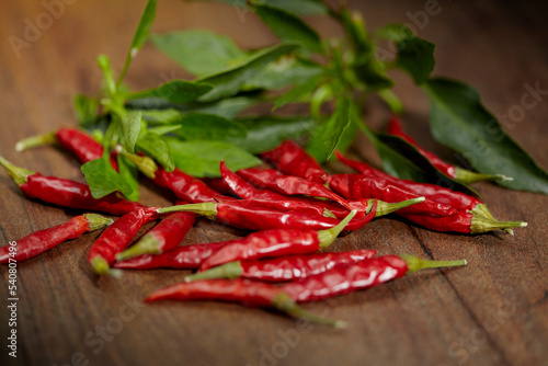 red hot chili peppers on wooden background