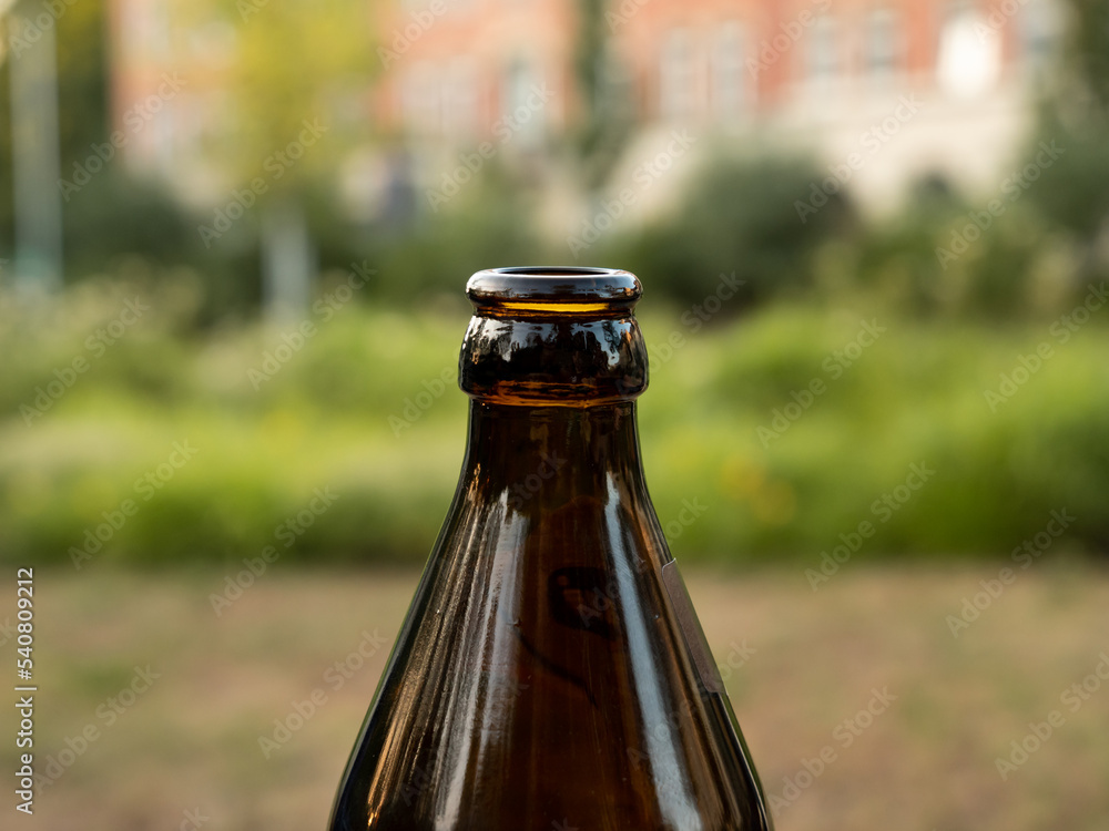 Bottle neck closeup of a German beer bottle. The tapered shape out of