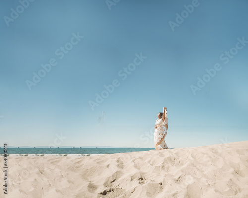 Photography Portrait of a woman wearing a saree on the beach