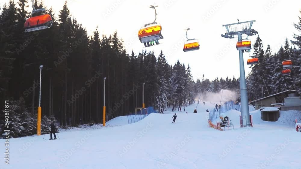 Ski resort, people skiing down the mountain, the lift is working, snow is around. The concept of vacation, tourism, vacations, travel, sports, athletes, competitions, healthy lifestyle .4k footage Ski resort, people skiing down the mountain, the lift is working, snow is around. The concept of vacation, tourism, vacations, travel, sports, athletes, competitions, healthy lifestyle .4k footage