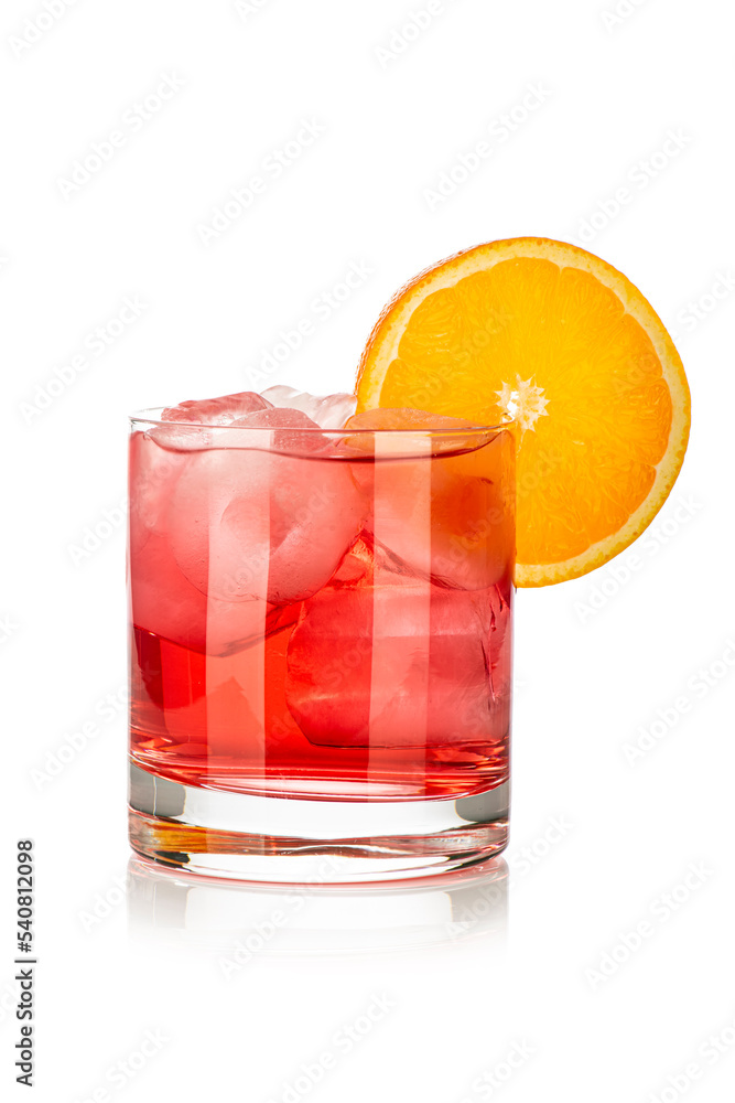 red drink with ice cubes and orange slice on white background, isolated