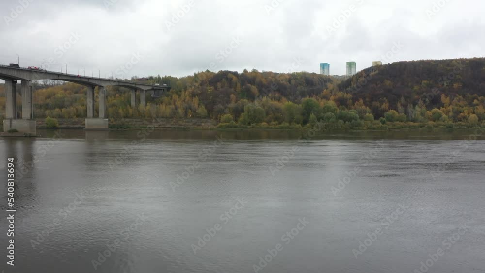 Shooting from the air. The landscape of the Oka River and the river bank. Autumn panorama. High quality 4k footage