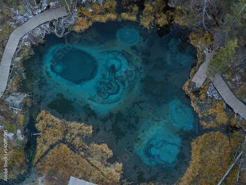 Blue geyser lake in the Altai Mountains, Siberia, Russia. Aerial view