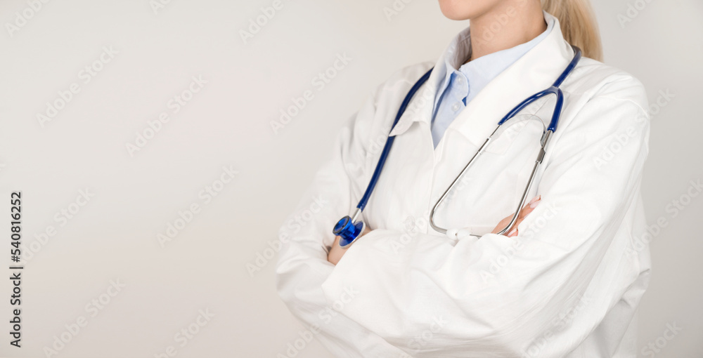 Healthcare and medical concept panoramic banner.Unrecognizable doctor in white lab coat and stethoscope. Copy space banner