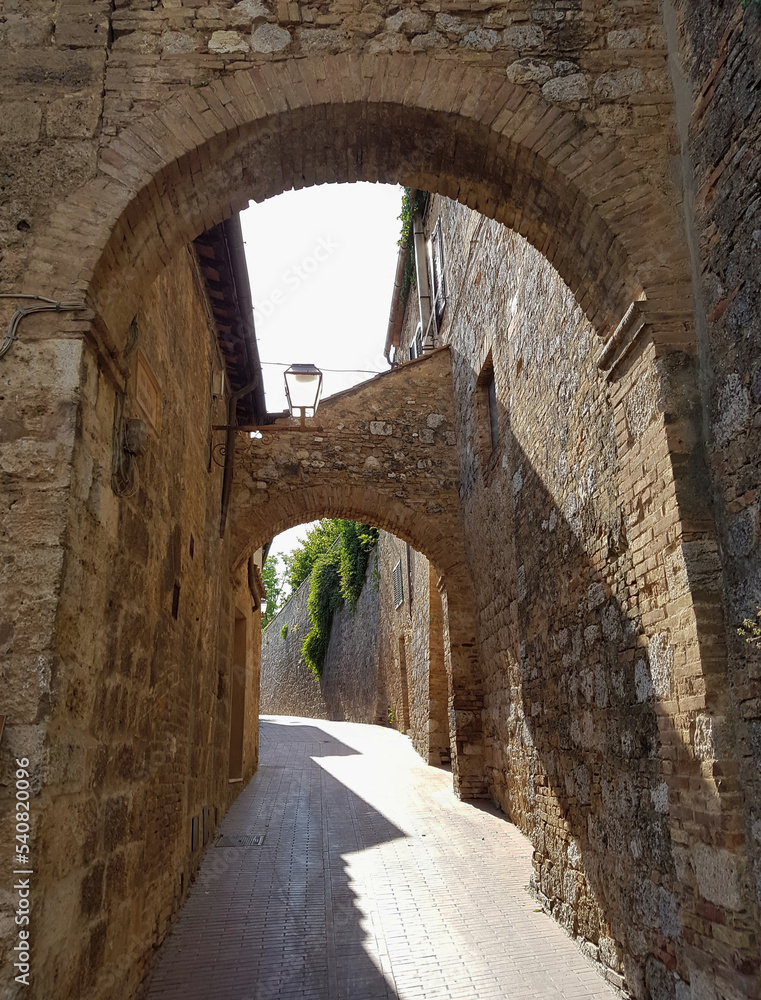 A typical street in a Tuscan town on a sunny summer day.