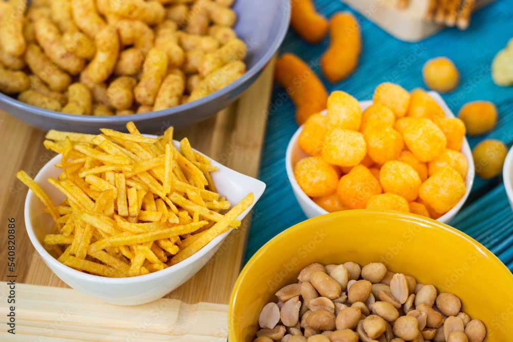 Beer salty snacks on wooden table