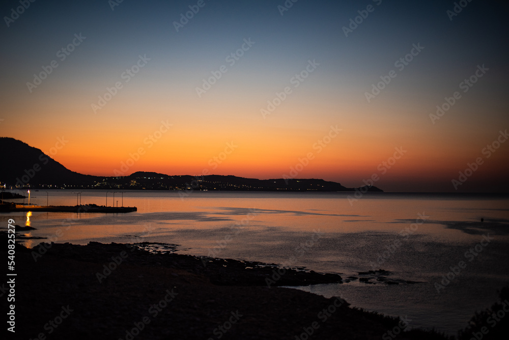 Obraz premium Sunset/Sunrise in Greece, Rodhes, with Lidos in background