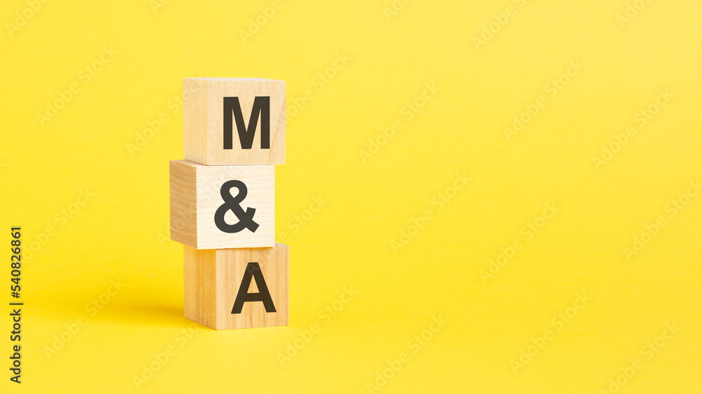 m and a symbol. beautiful yellow background. business concept. copy space. m and a symbol. beautiful yellow background. business concept. copy space.