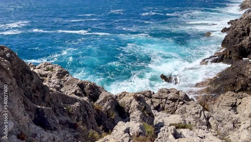 Cephalonia Greek island rocky shore slow motion Ionic sea waves landscape 4K footage. Beauty in nature and traveling concept.
