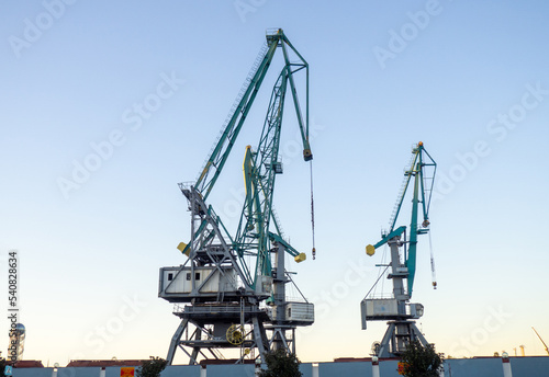 Wallpaper Mural Port cranes against the sky. loading mechanism.  Sea freight concept Torontodigital.ca