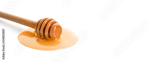 Wooden honey dipper on white background with space for text