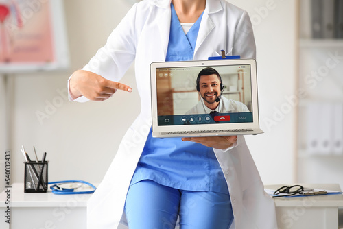 Doctor video chatting with ...