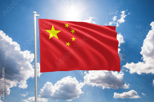 Flag of China waving in the wind. Chinese flag on a sunny day with blue sky