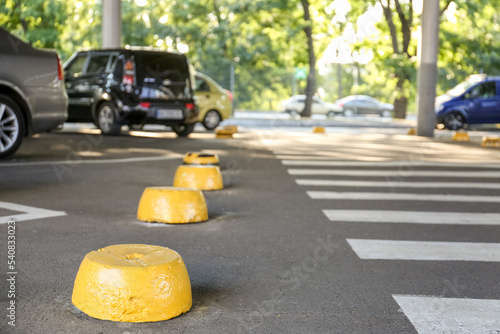 Yellow limiters on parking lot
