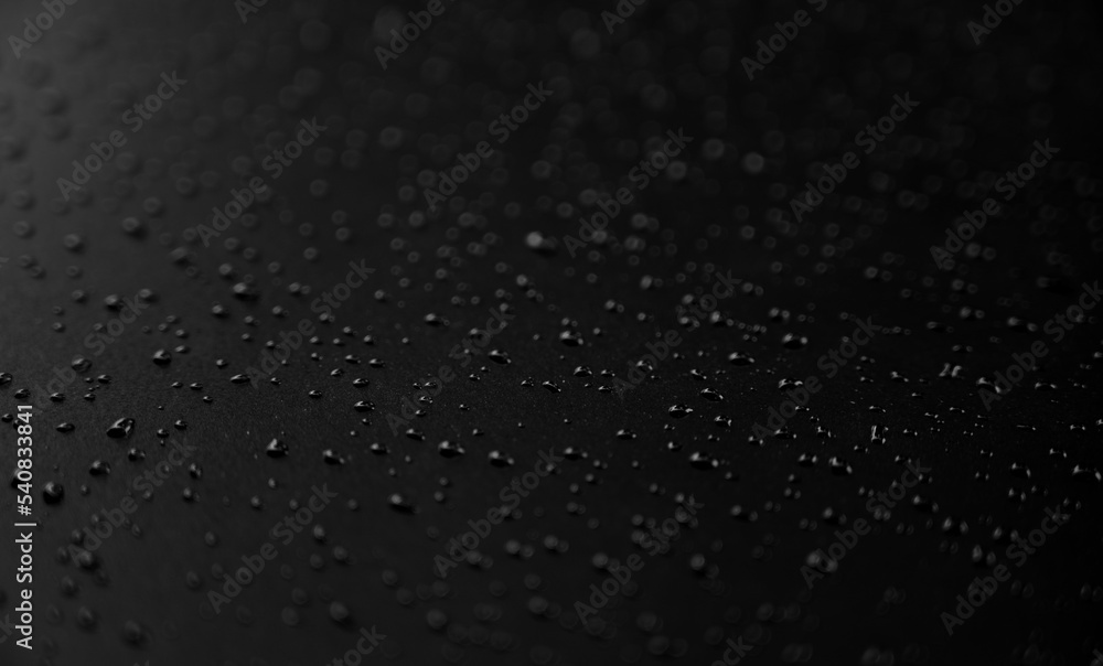 Water droplets on the floor with black background