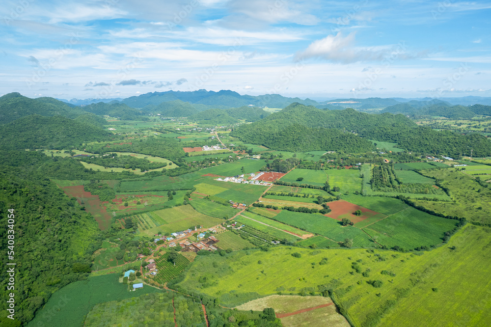 top view farm with mountain background, Aerial view from flying drone of farm, landscape nature blue sky and hill
