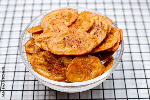 Banana chips on white background