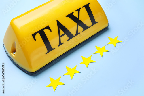 Yellow taxi roof sign and p...
