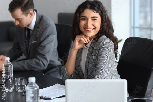 Young businesswoman having meeting in office