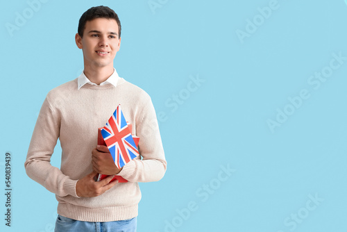 Teenage boy with UK flag on...