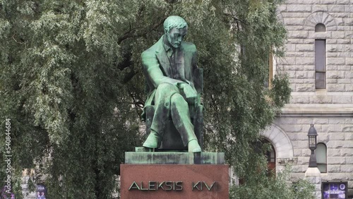 The Aleksis Kivi statue situated on the Rautatientori square in Helsinki, Finland photo