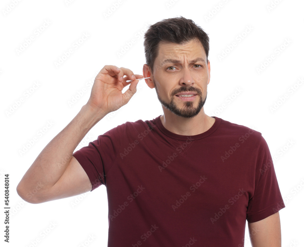 Emotional man cleaning ears on white background Emotional man cleaning ears on white background