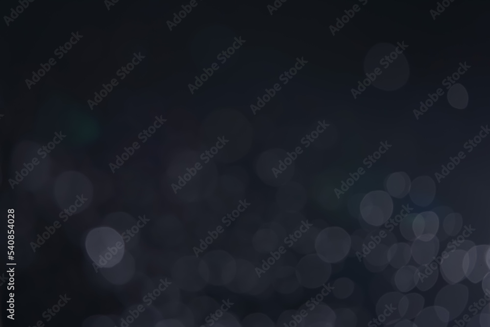 A dark blue background bokeh image for used to decorate background. A dark blue background bokeh image for used to decorate background.