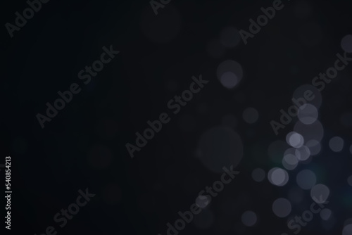 A dark blue background bokeh image for used to decorate background.