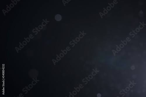 A dark blue background bokeh image for used to decorate background.