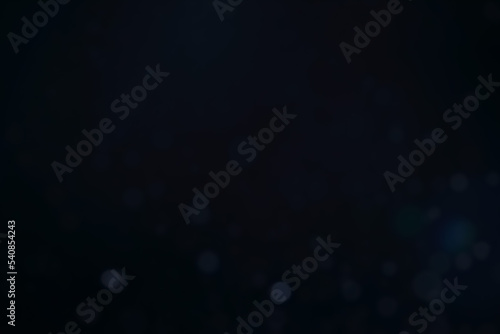 A dark blue background bokeh image for used to decorate background.