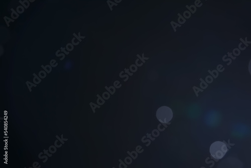 A dark blue background bokeh image for used to decorate background.