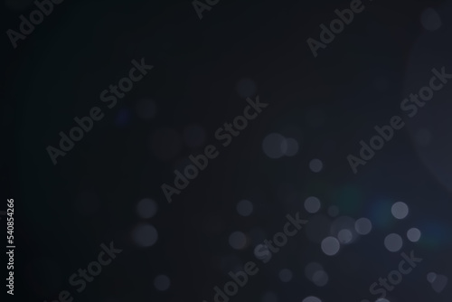 A dark blue background bokeh image for used to decorate background.