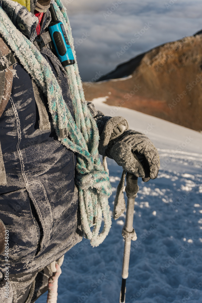 Fototapeta premium mountaineer with rope and frozen clothes
