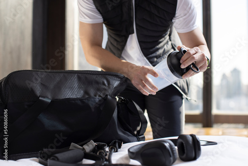 Mid adult man getting ready to go out and workout