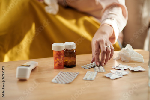 Sick Woman Grabbing Medicine