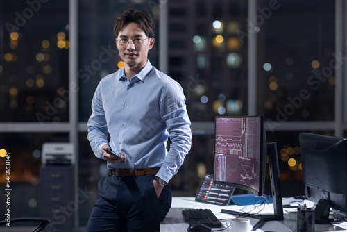 Businessman working in office at night