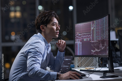 Businessman working in office at night