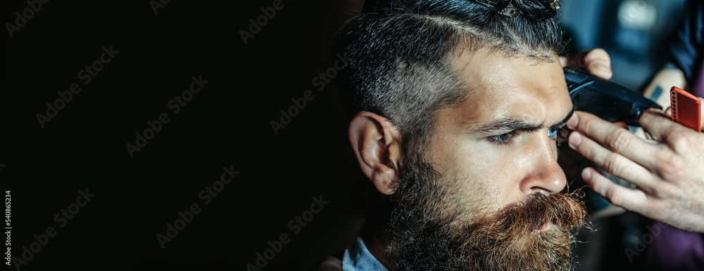 Fototapeta premium Beard man with classic long beardin barbershop. Shaving in barber shop. Mustache men. Templates web banner design. Horizontal banner for website header with text copy space.