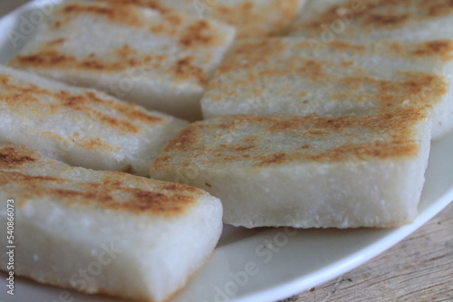 Wallpaper Mural A plate of grilled sticky rice on a wooden table Torontodigital.ca