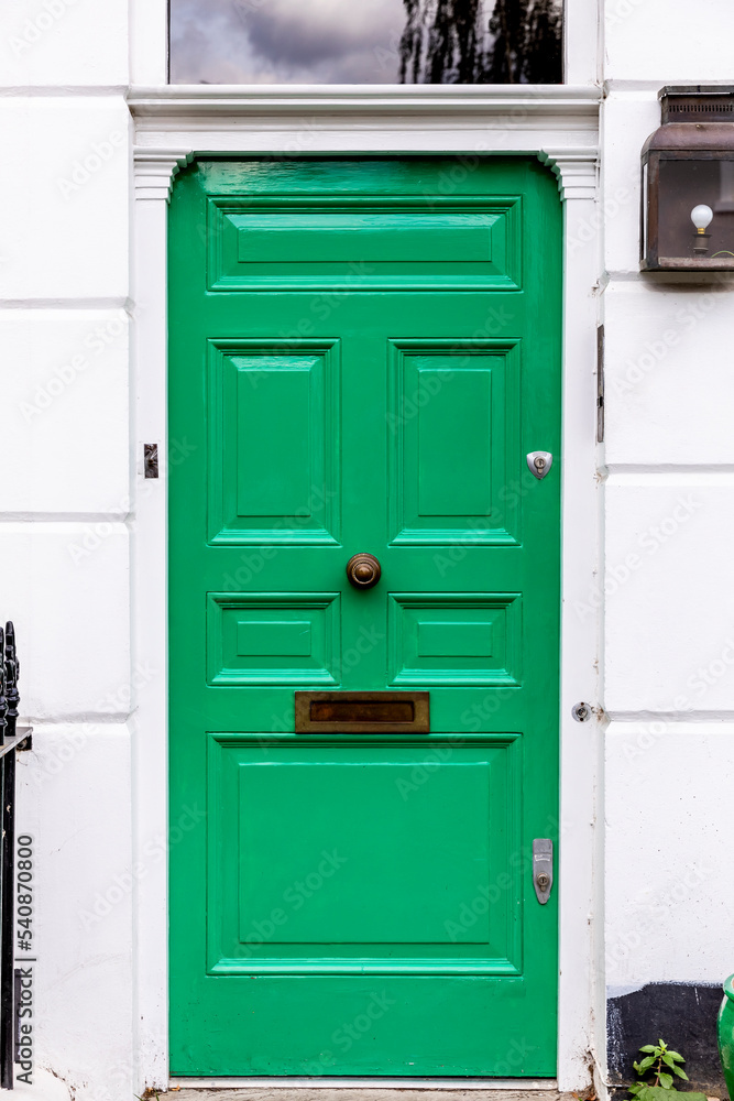 Front green door with mail slot. Front green door with mail slot.